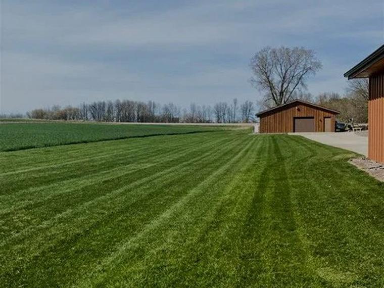 A freshly cut and striped lawn on a Green Bay property maintained by Two Guys USA